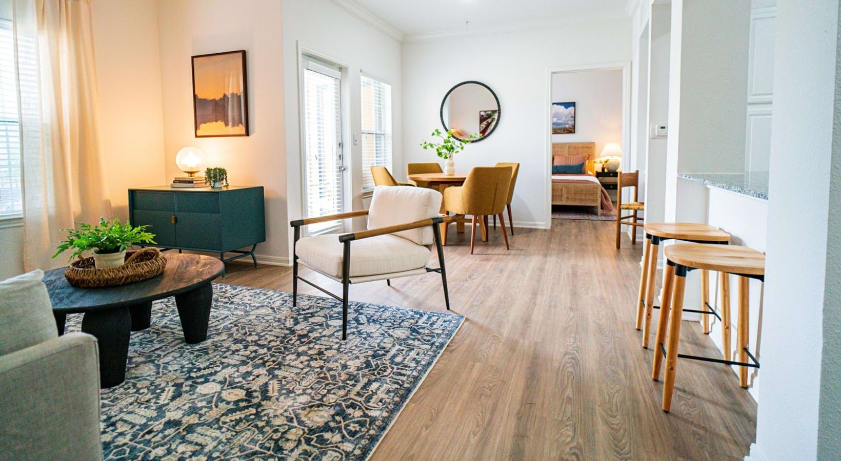 Generous living spaces to relax and unwind furnished living room and dining area with large windows