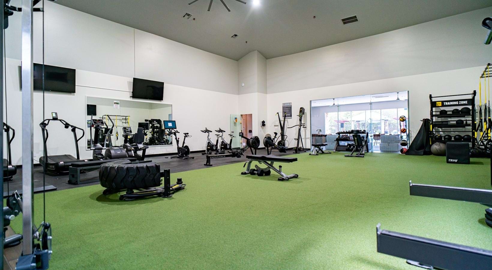 Get your workout on spacious fitness center with ample lighting
